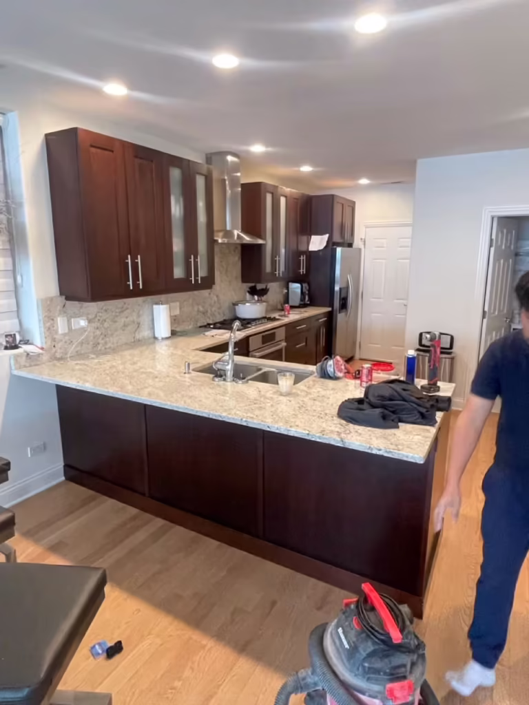 Espresso peninsula and granite counters during the West Chicago refacing