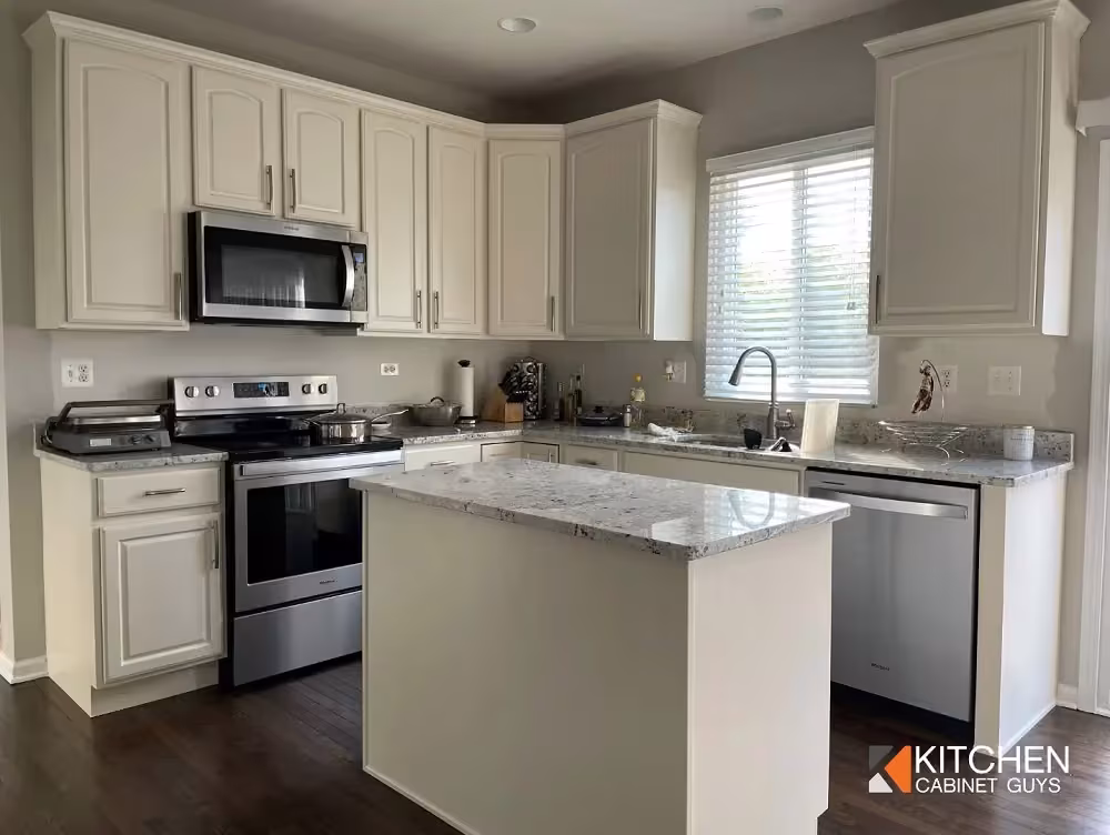 White and sage kitchen with an island built to last