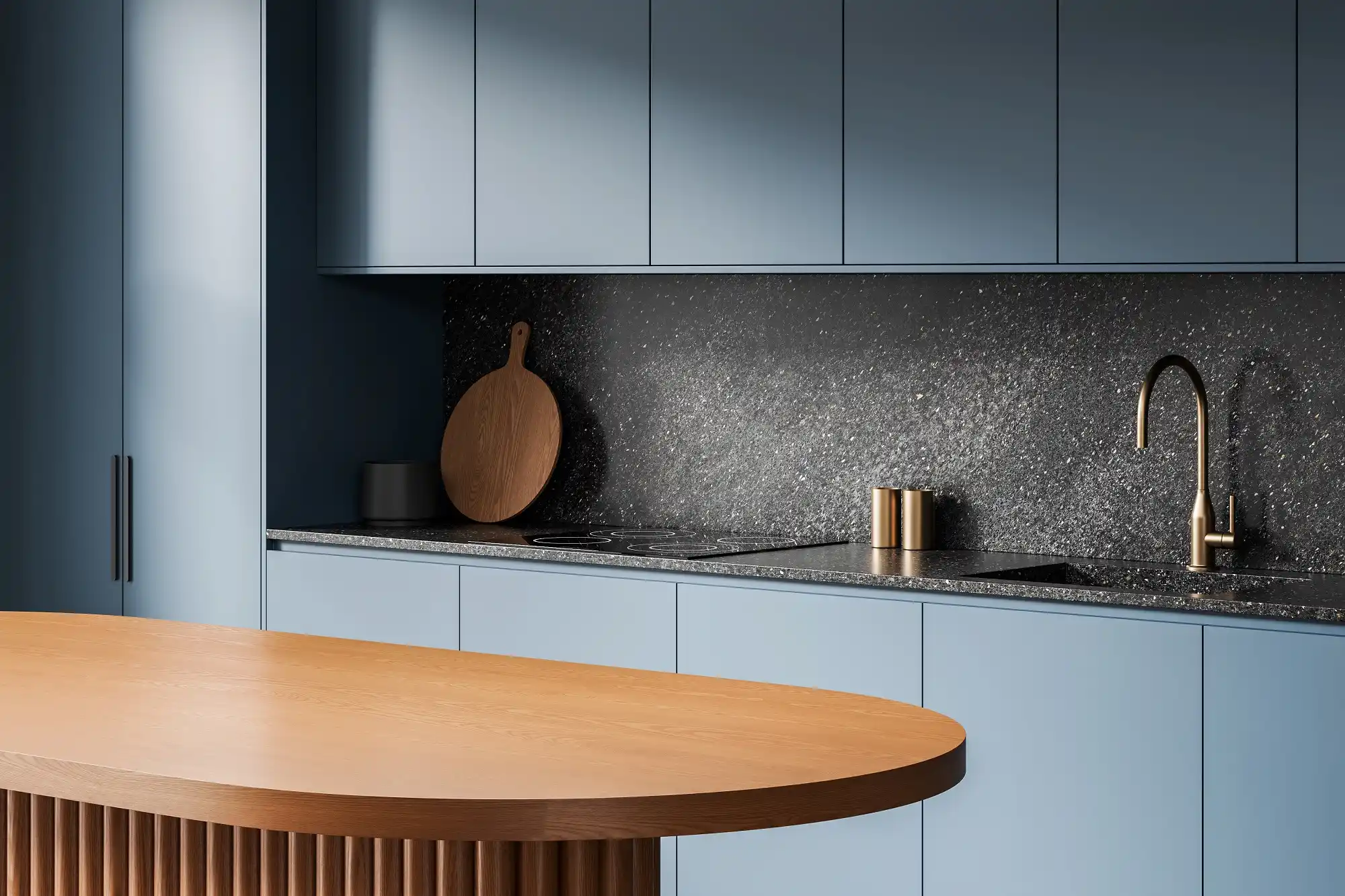 Blue-gray handleless cabinets and a rounded wood island in Westchester