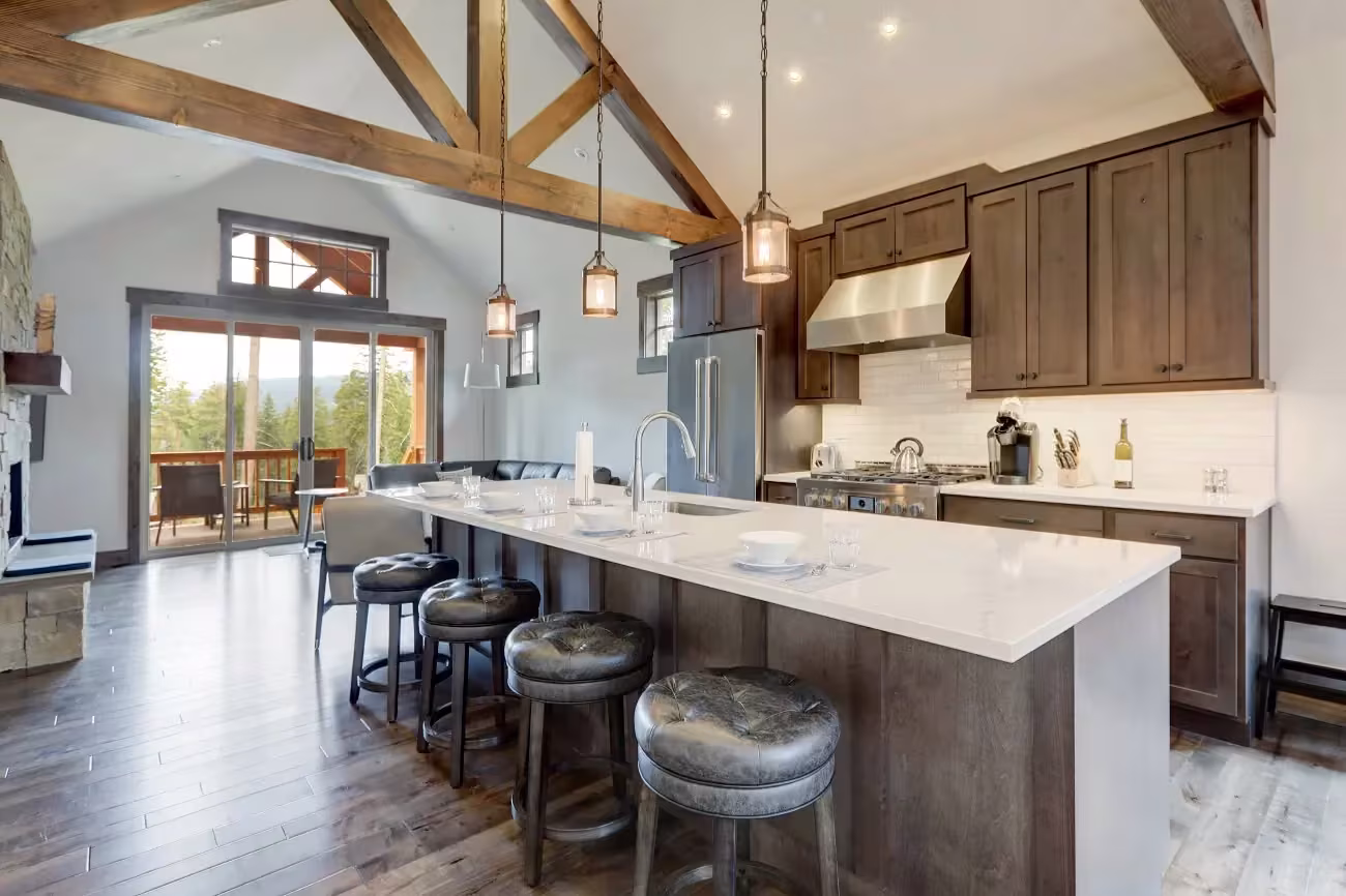 Wood cabinets and a white island under vaulted beams in South Elgin
