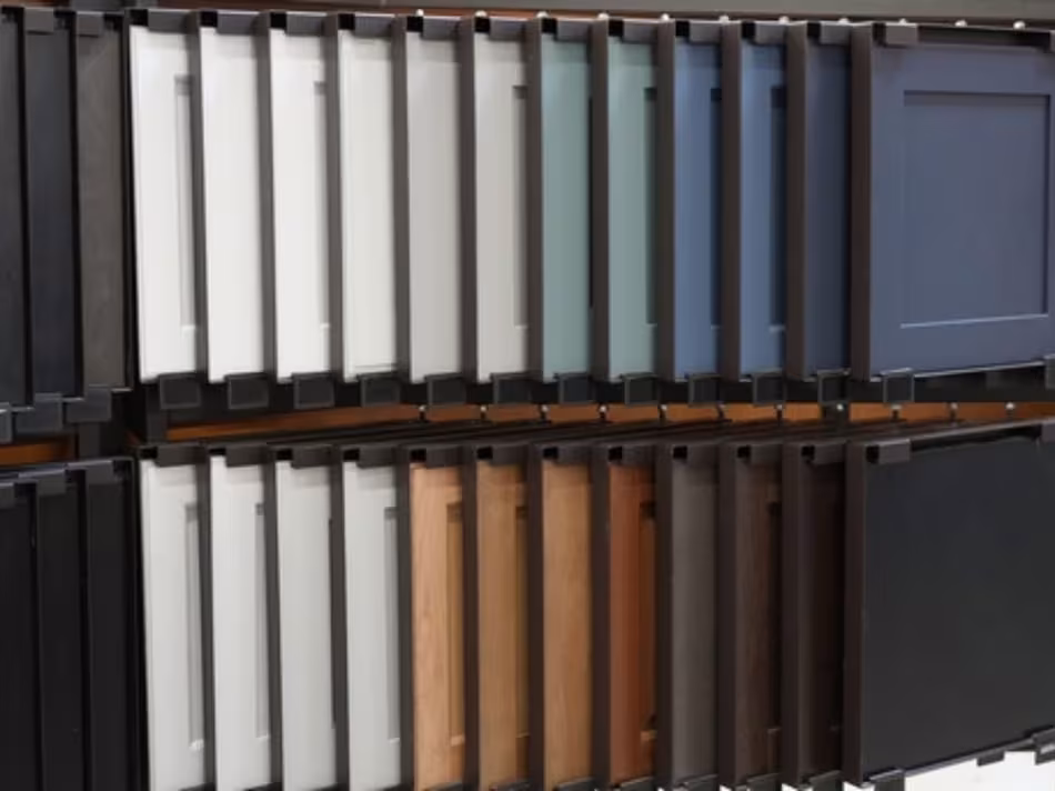 Fan display of cabinet door samples in painted and woodgrain finishes