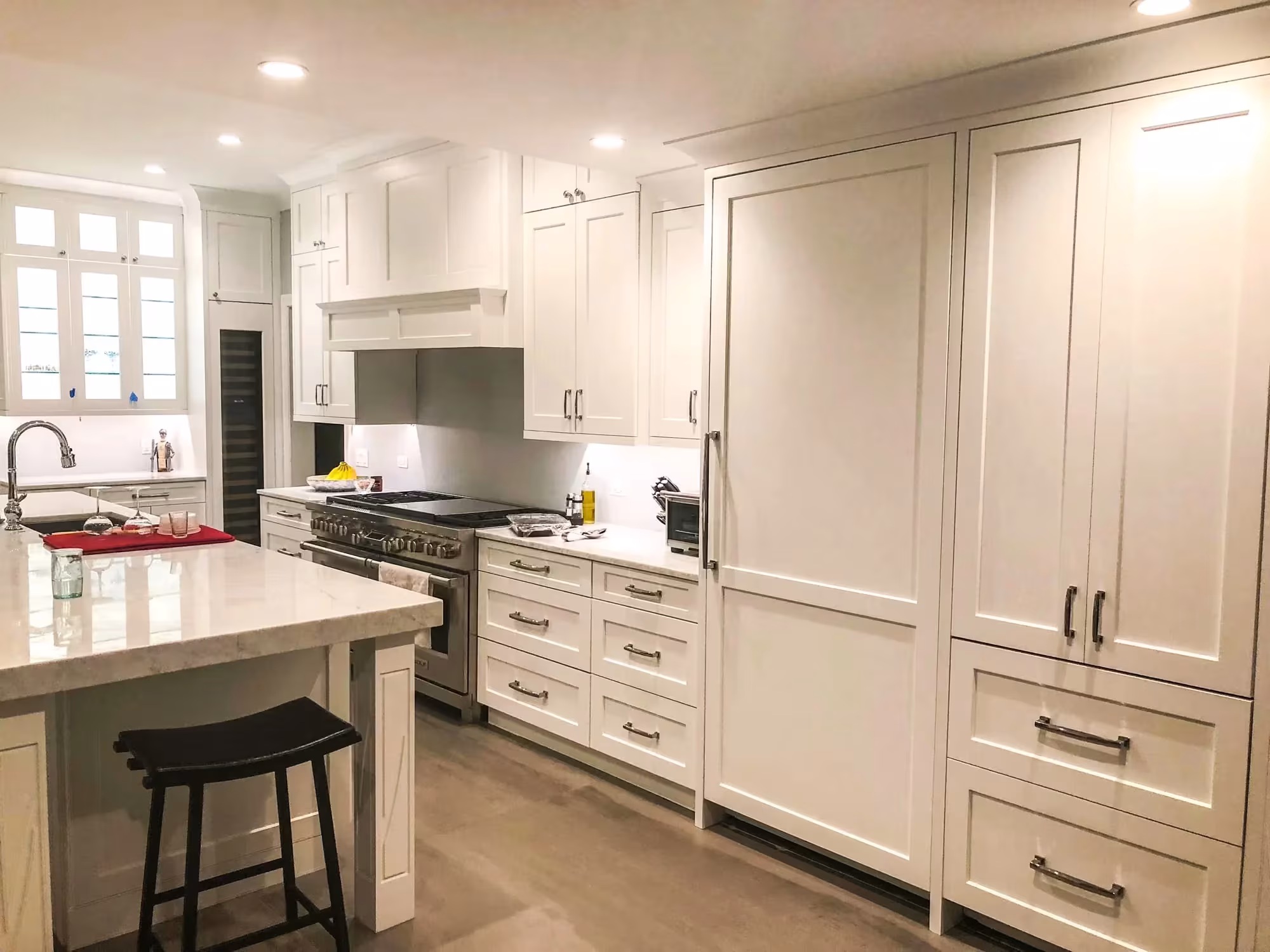 Cream inset cabinets and a large island in a traditional kitchen