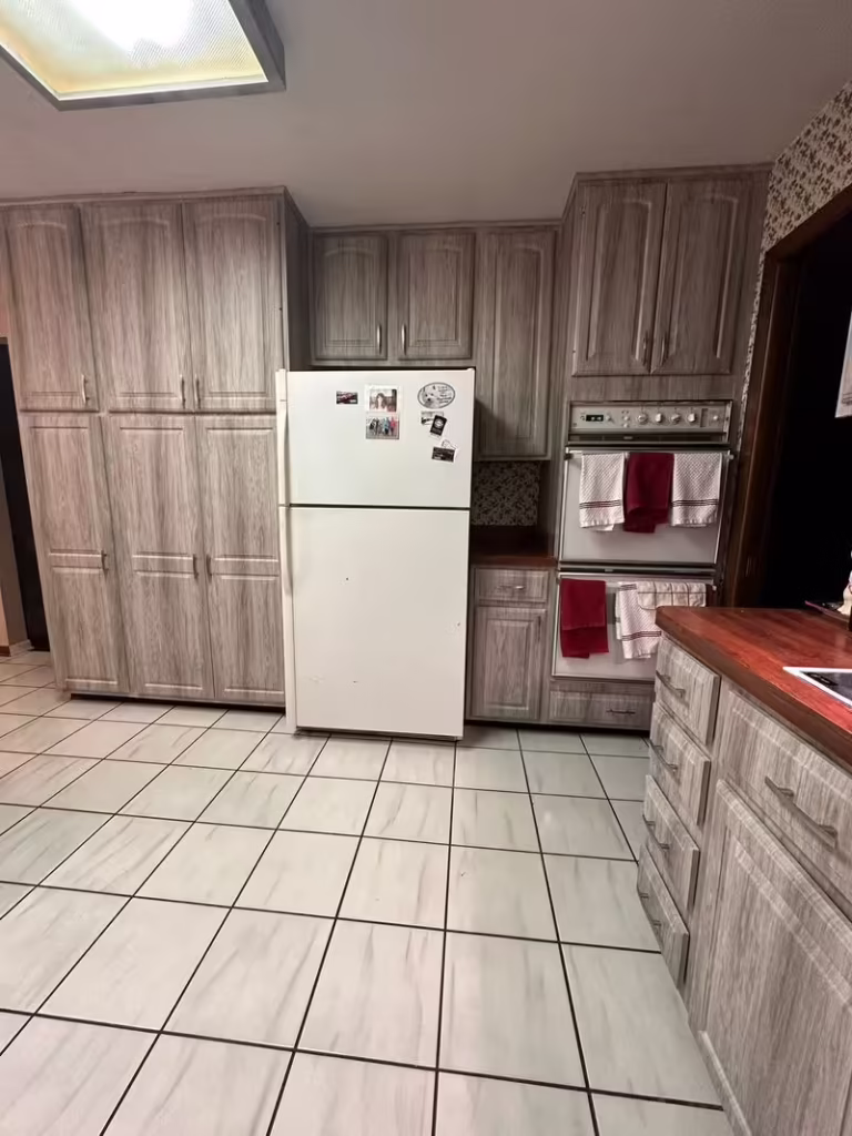 Gray wood-structure cabinets after refacing the Batavia kitchen