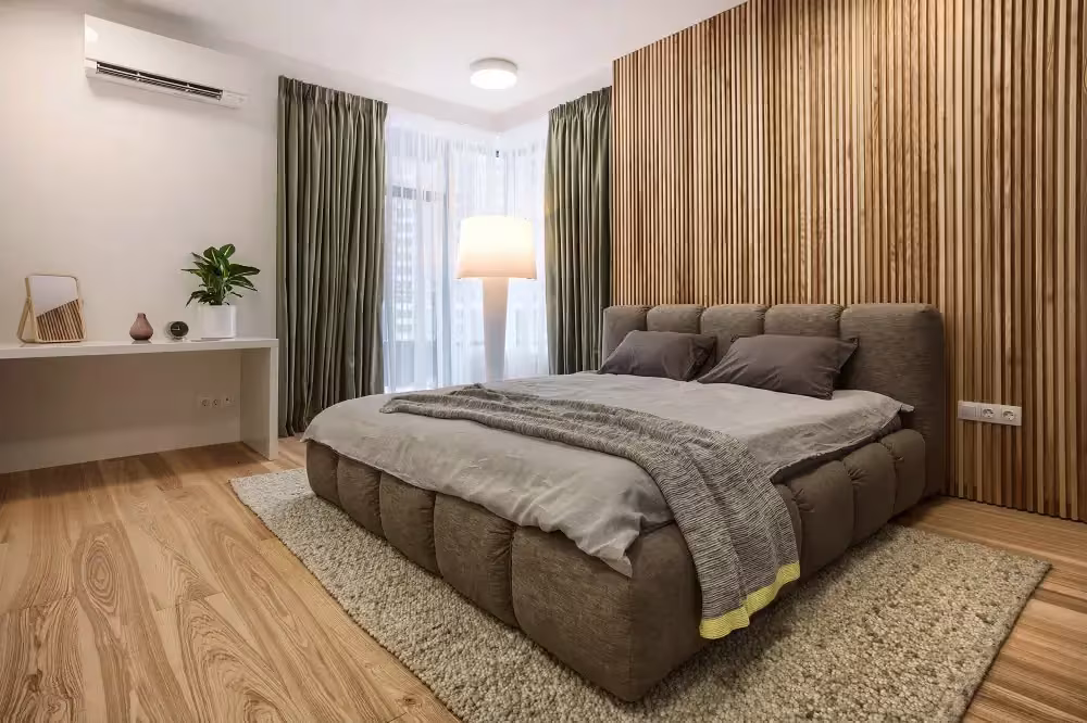 Bedroom with vertical wood slat panelling behind the bed