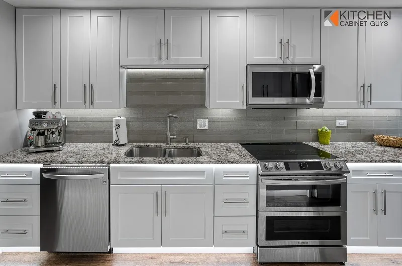 Gray Shaker kitchen with granite counters after thermofoil door repair