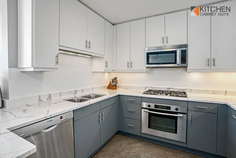 White and gray kitchen with a built-in oven after the doors were replaced
